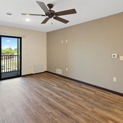 wood floor living room at Rivertown Residential Suites located in Monticello, MN