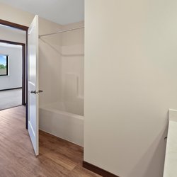 wood floor bathroom at Rivertown Residential Suites located in Monticello, MN