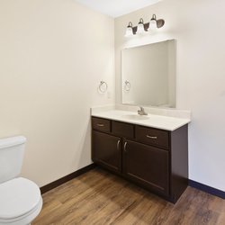 wood floor bathroom at Rivertown Residential Suites located in Monticello, MN