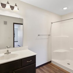 wood floor bathroom at Rivertown Residential Suites located in Monticello, MN